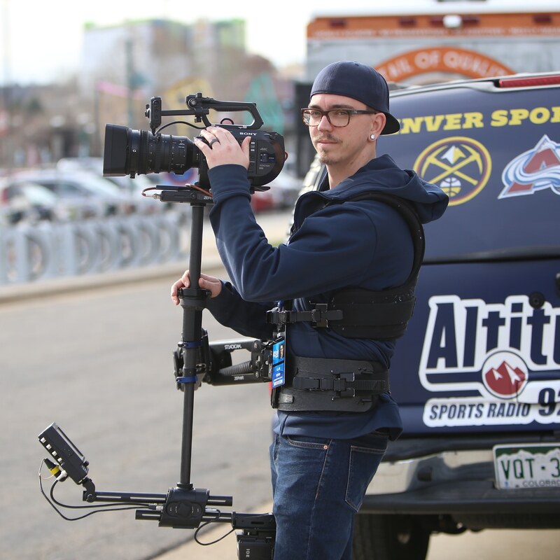 Alan Meyer wearing steadicam at tailgate event before Denver Nuggets Playoffs game. 